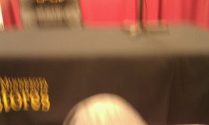 Josh Preston sitting uncomfortably close to Michio Kaku's signing table